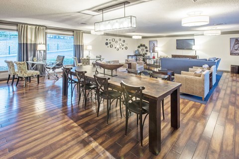 a living room with a dining room table and a couch